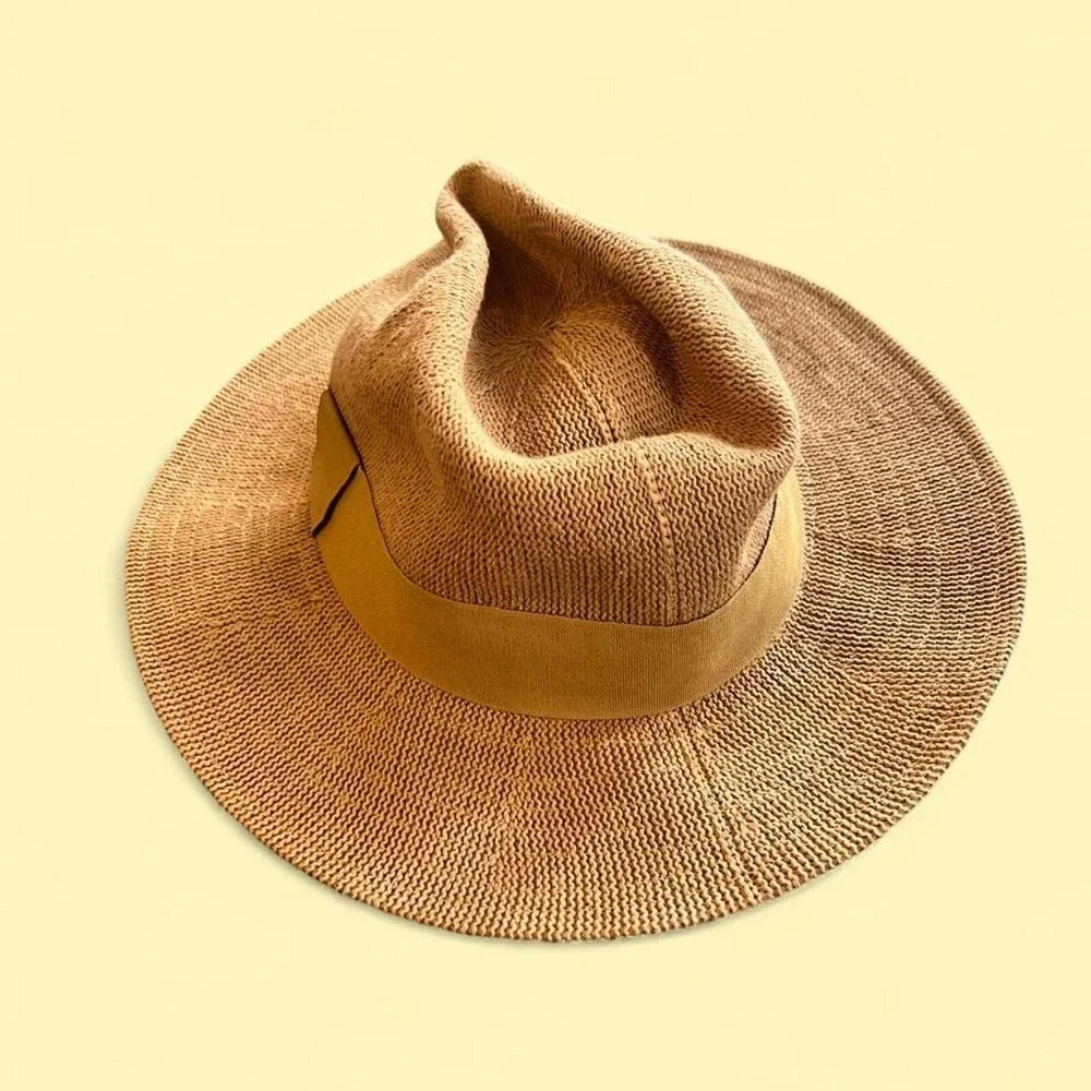 Tan straw fedora with a wide brim and a suede band. #western #boho